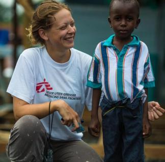 MSF woman standing with young boy